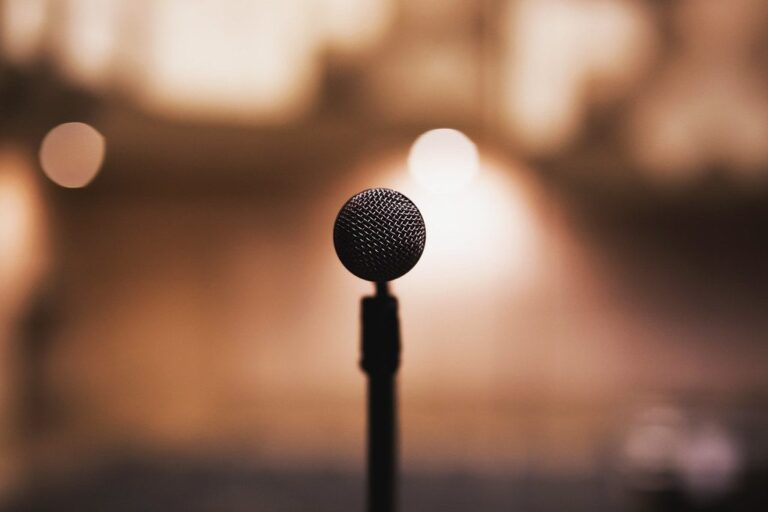 Microphone on a stand with warm stage lights