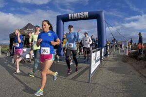 Runners crossing the finish line of a race