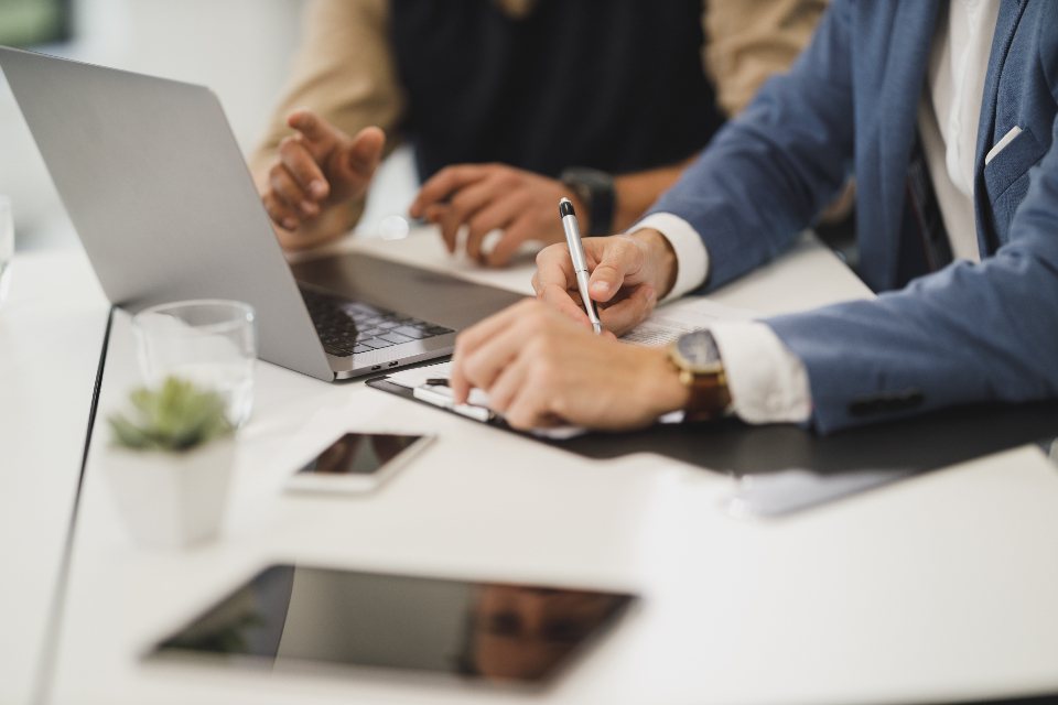 Colleagues working on laptops during a business planning session