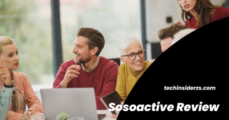Business team reviewing ideas around a laptop in a bright office